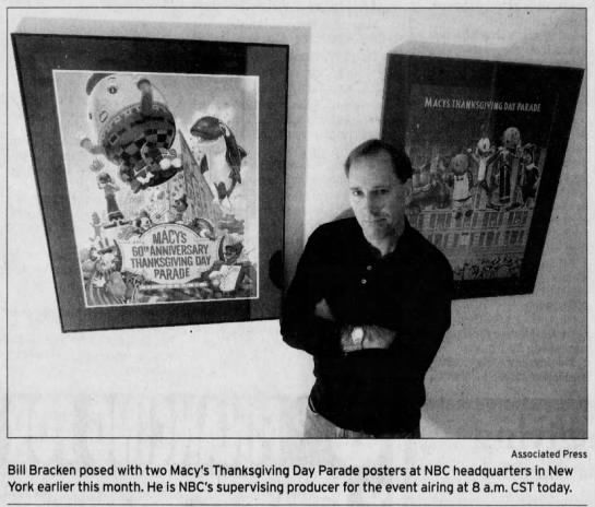 Bill Bracken posed with two posters